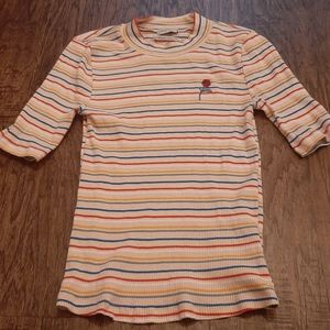 Pink Girls Large rainbow striped ribbed tee.